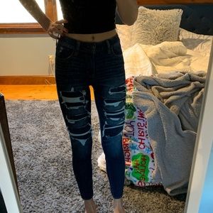 patched dark wash jeans